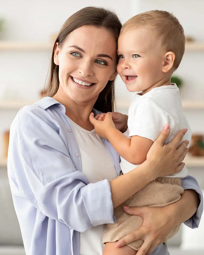 happy beautiful young mother cuddling her adorable 8BCSFAL