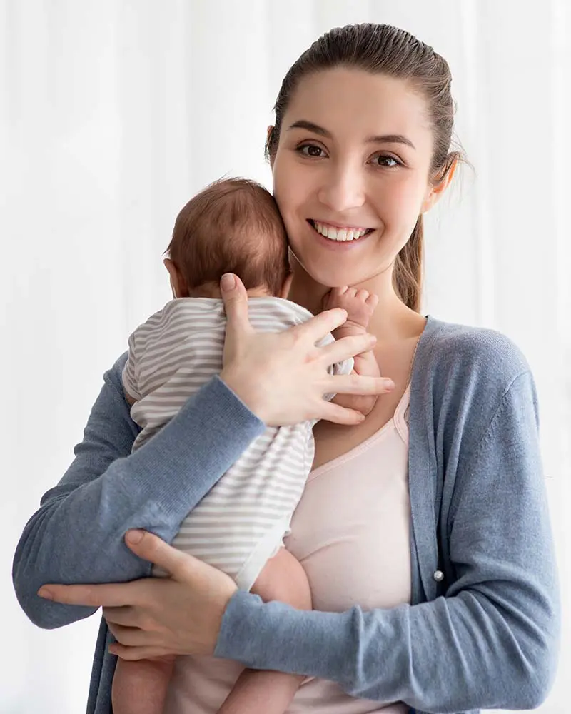 happy motherhood portrait of beautiful young mom C4UPA7G